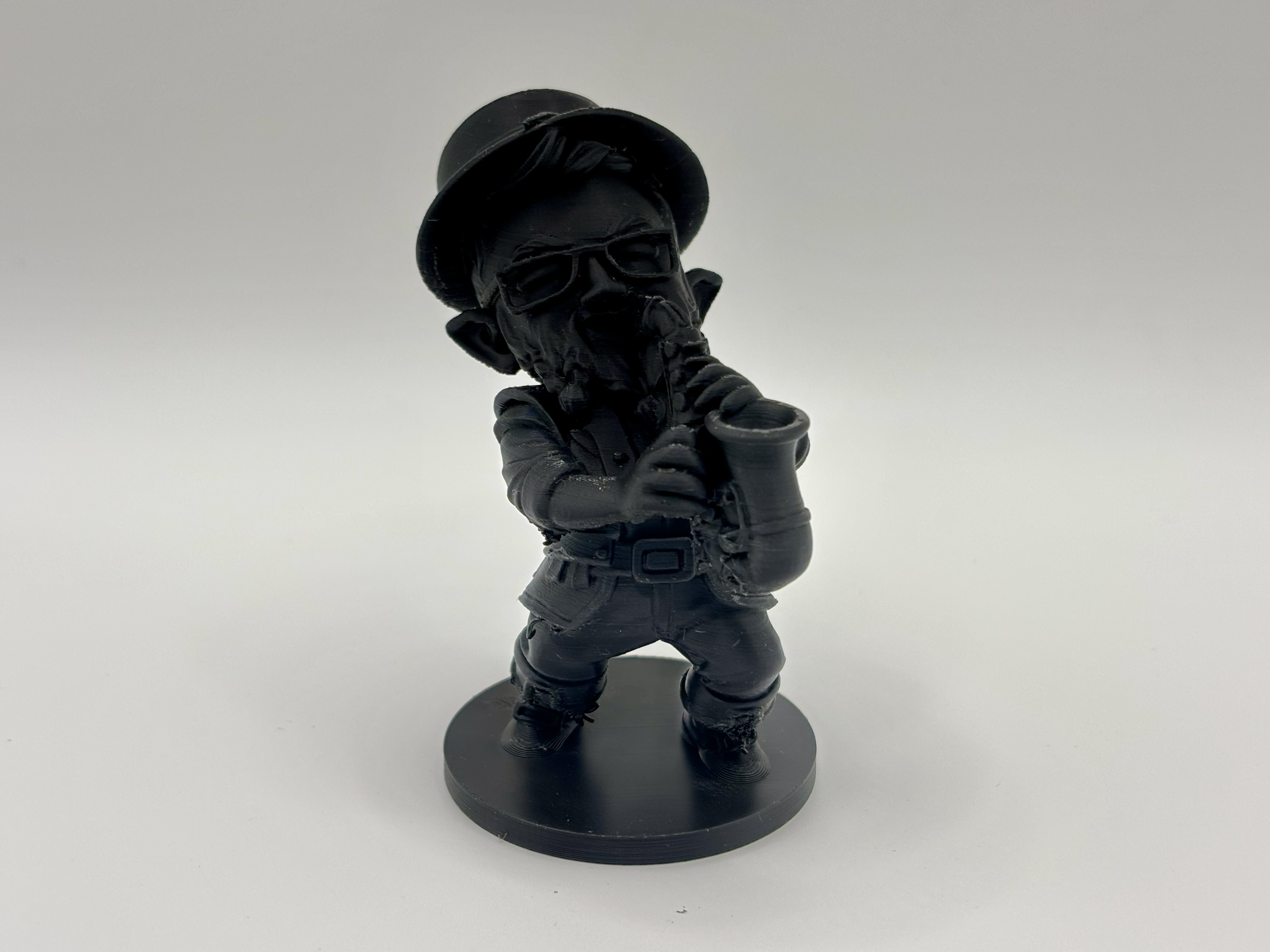 3D printed leprechaun miniature playing a saxophone by Onyx 3D Printing