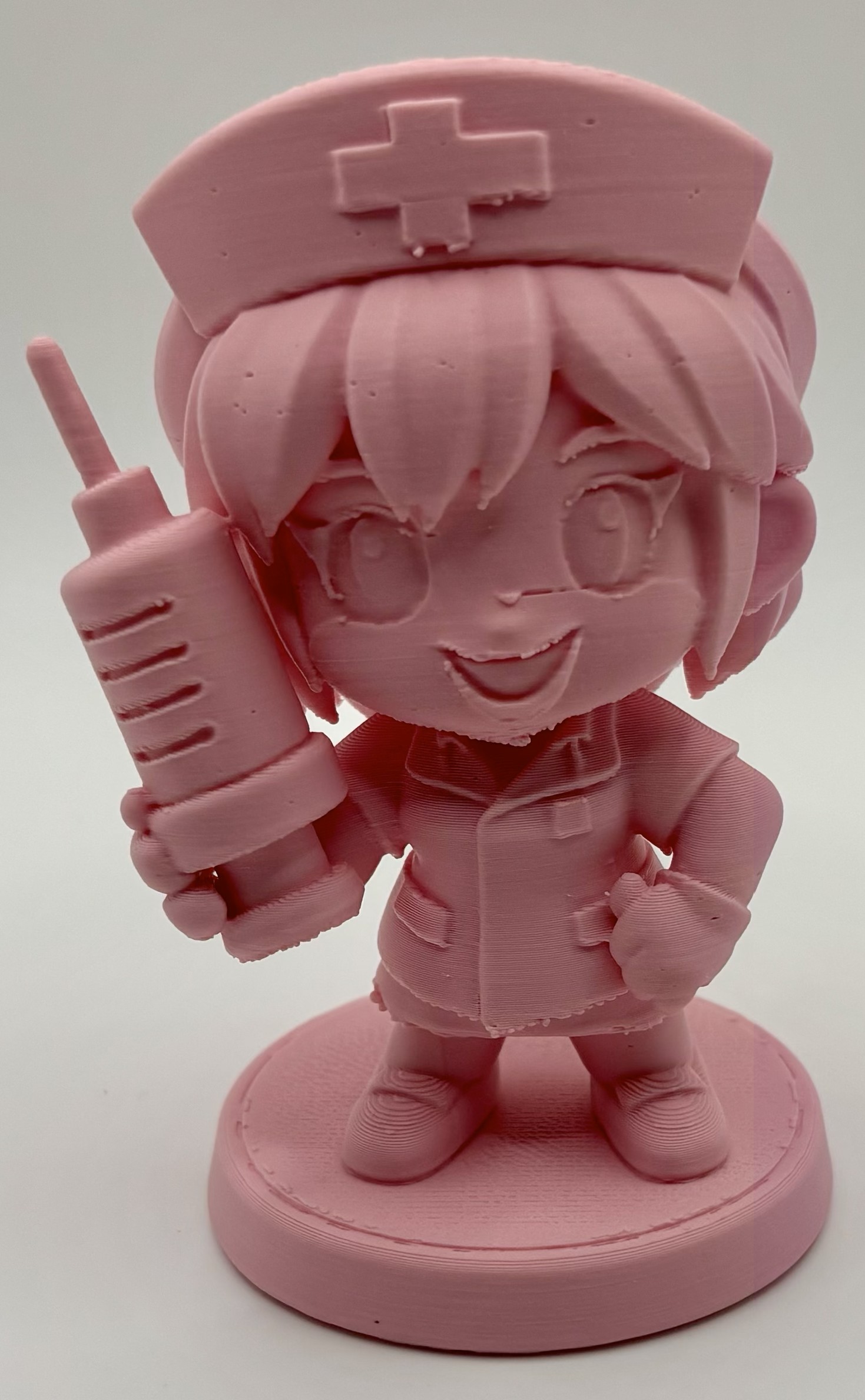 3D printed chibi nurse miniature holding a syringe by Onyx 3D Printing