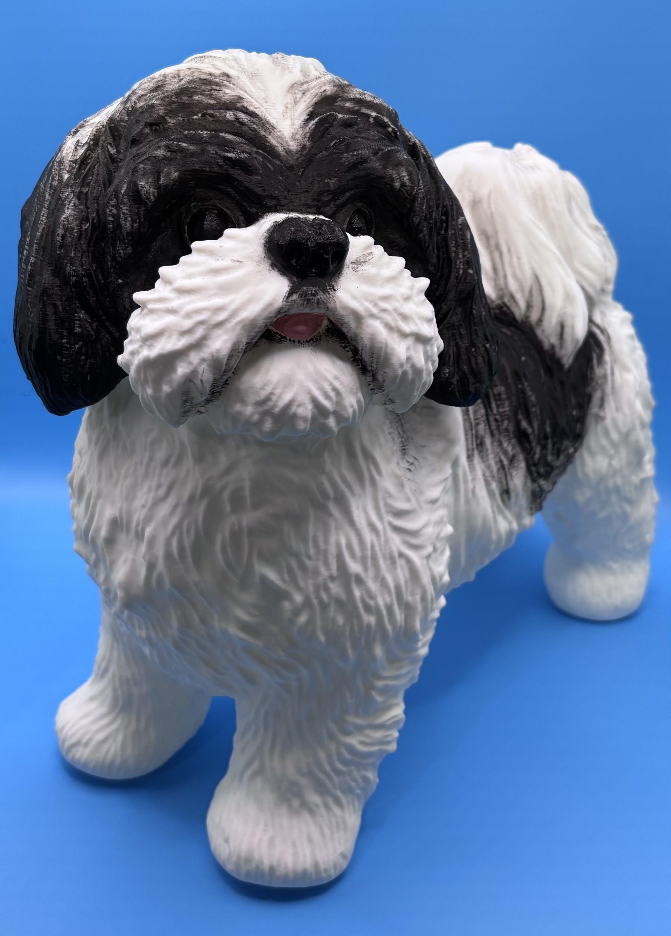 Custom 3D printed dog figurine with black and white fur detailing shown from the front