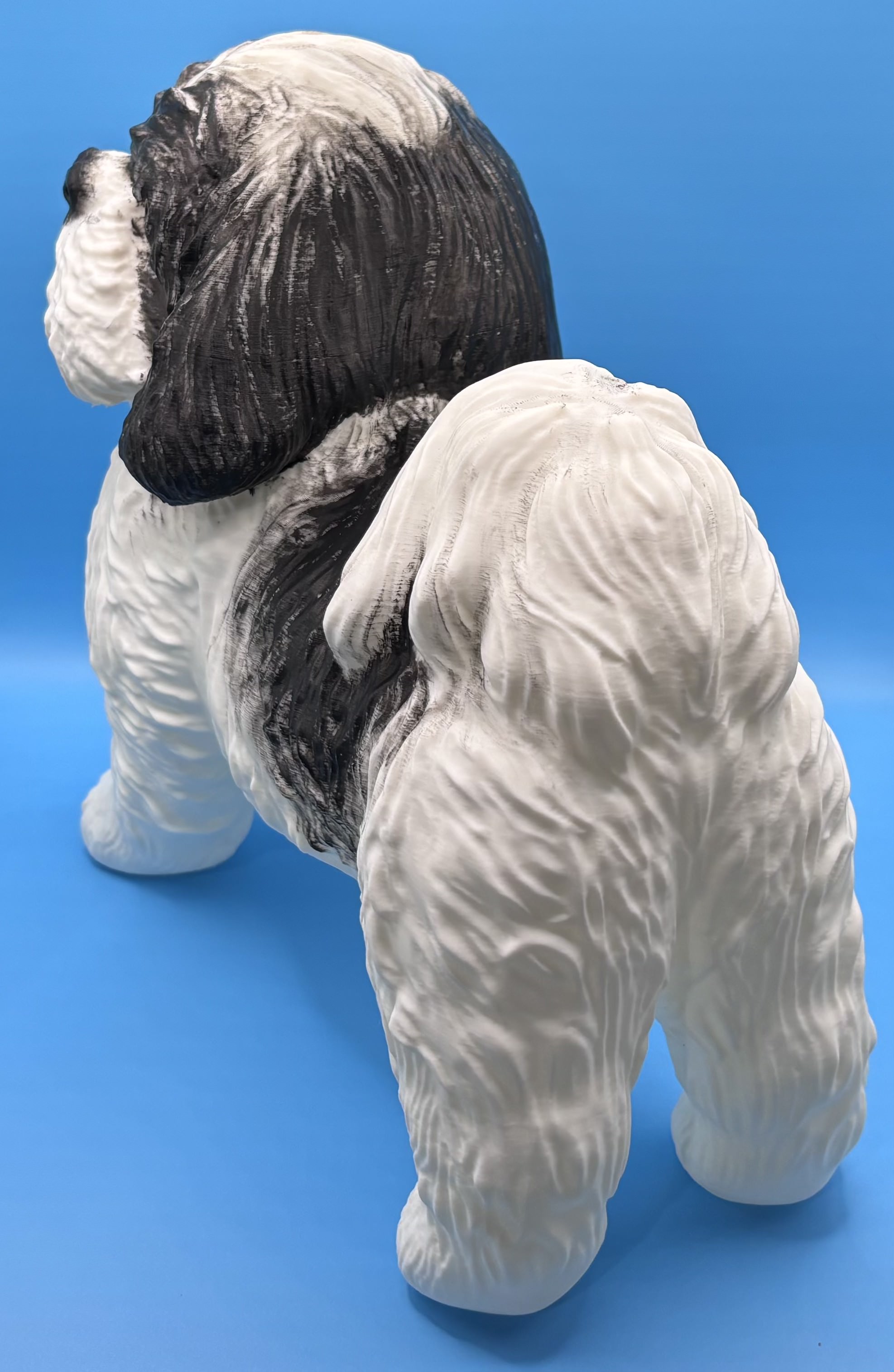 Rear view of a custom 3D printed dog figurine showing textured fur and tail detail