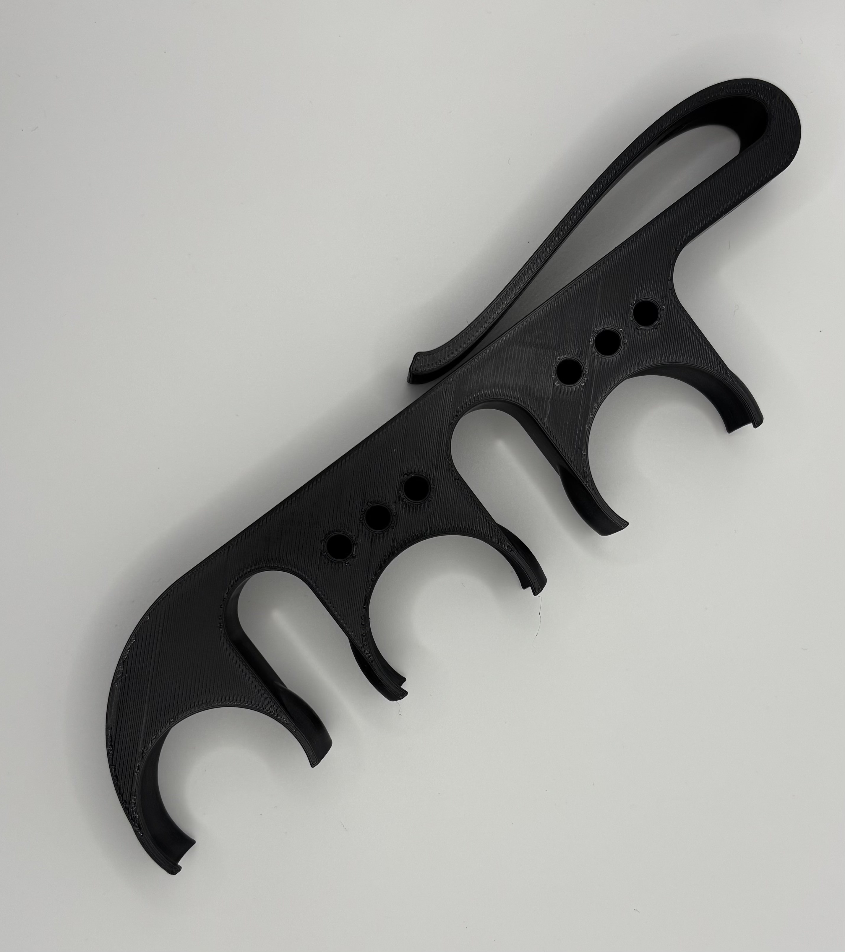 3D printed golf ball holder accessory in black, compact design for golfers, made by Onyx 3D Printing