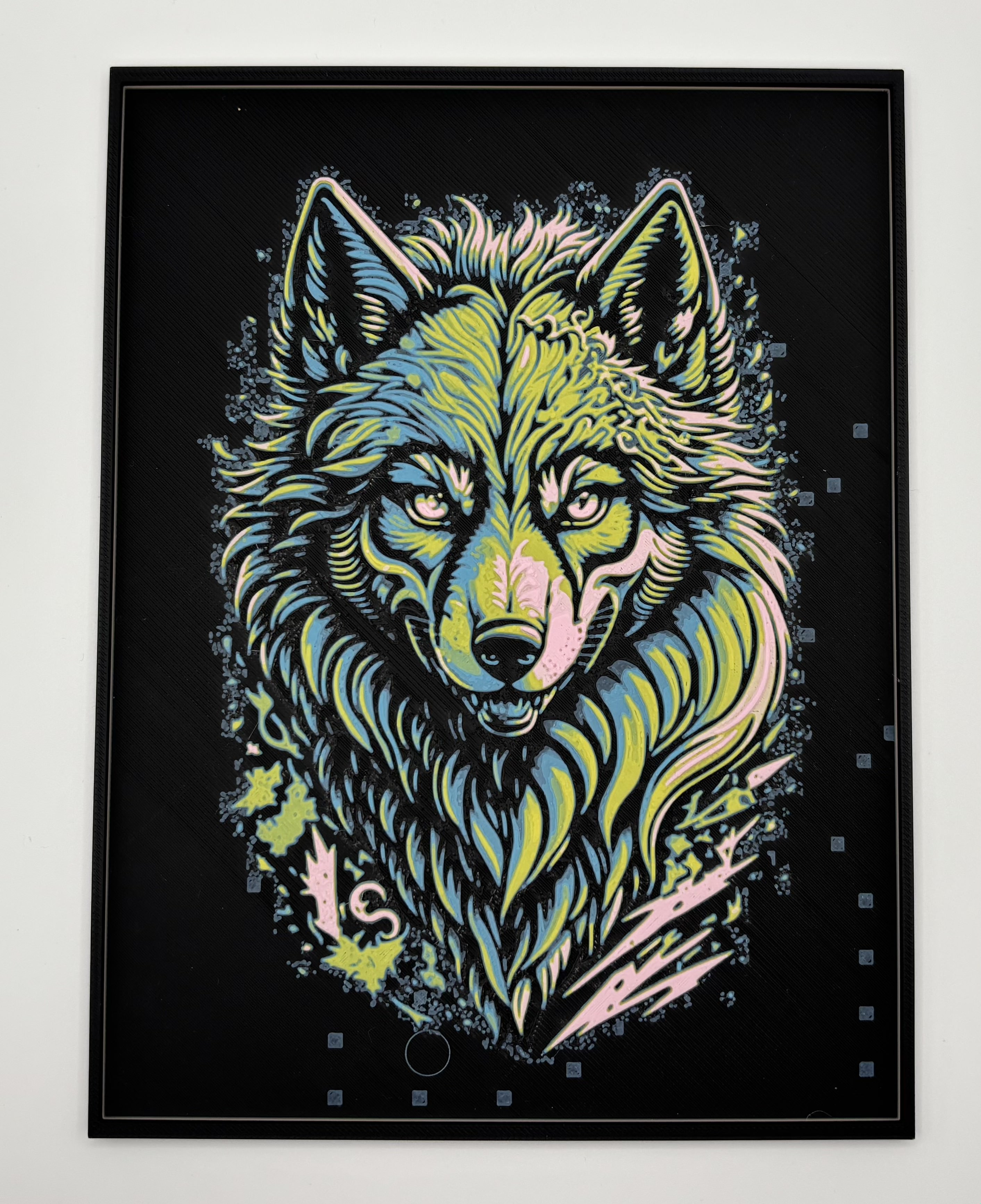 HueForge 3D printed wall art of a neon-style wolf head on a black background with blue, 		yellow, and pink highlights, modern animal artwork