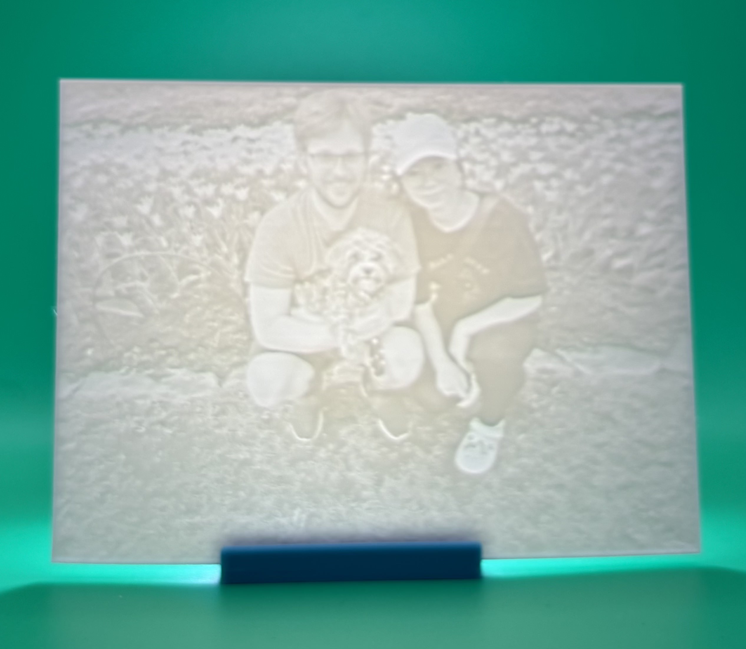 Custom 3D printed lithophane of a couple sitting outdoors together, personalized backlit 		photo keepsake