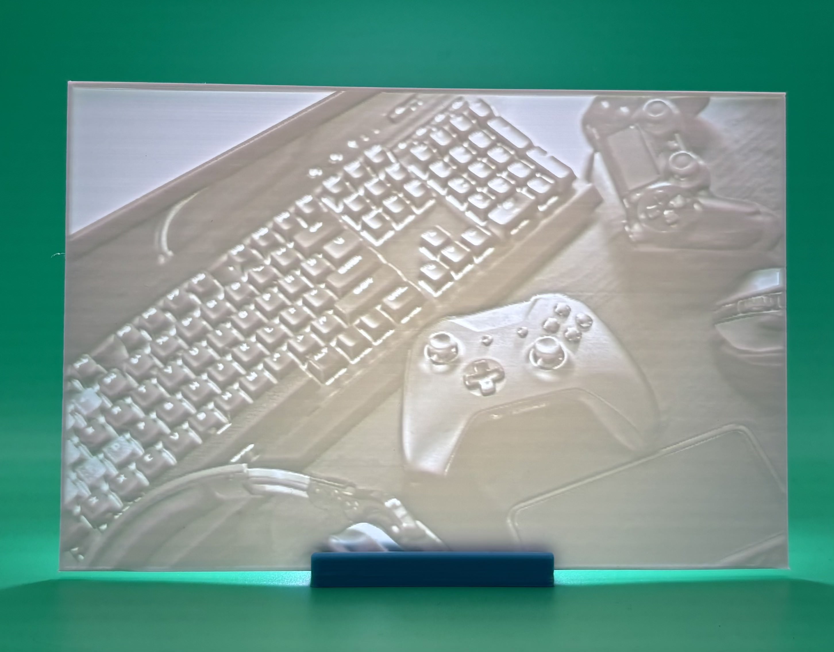 Custom 3D printed lithophane showing a gaming setup with keyboard, controller, and 		headset, backlit personalized gamer decor
