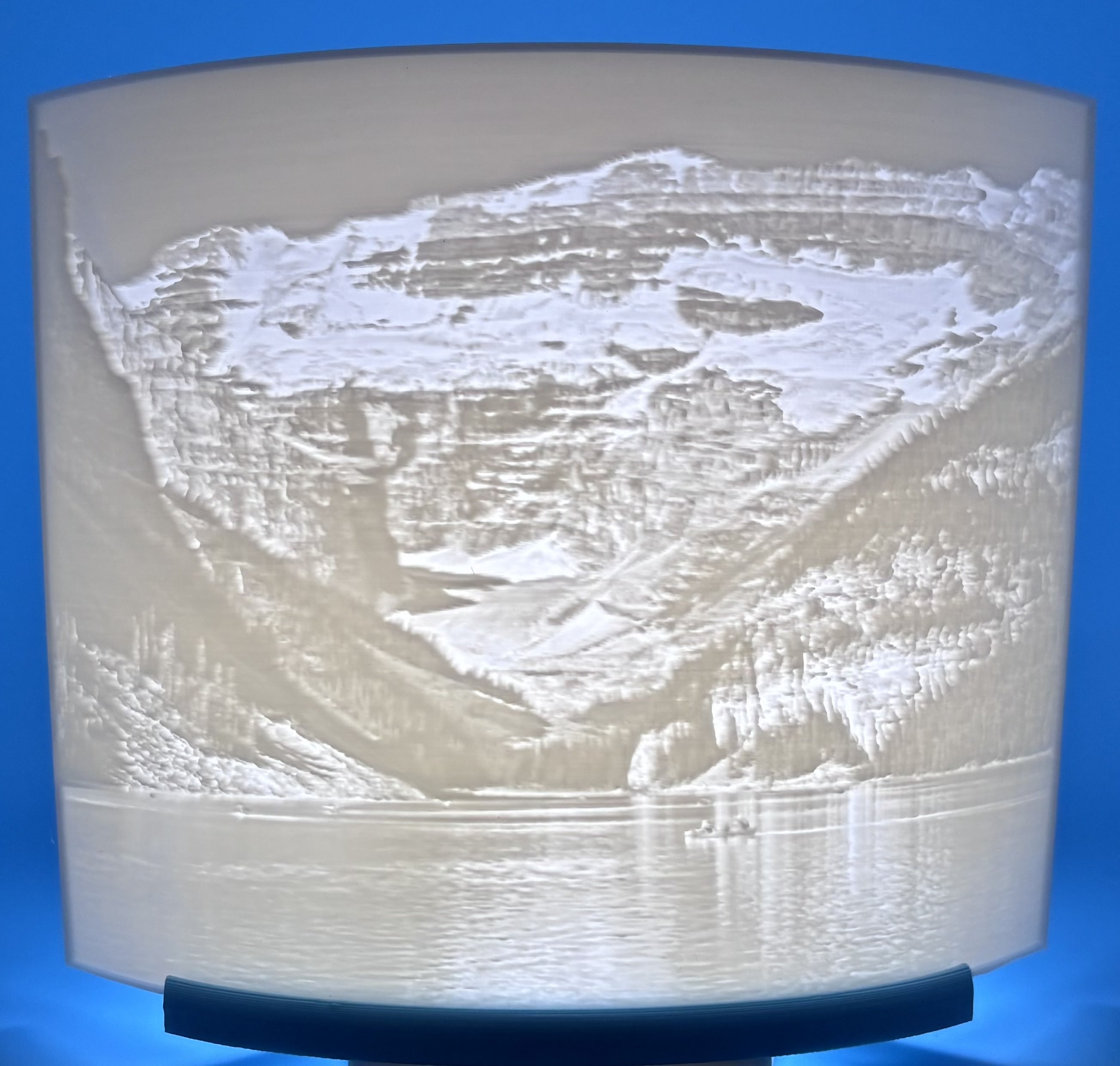 3D printed landscape lithophane showing a mountain lake with trees and reflection