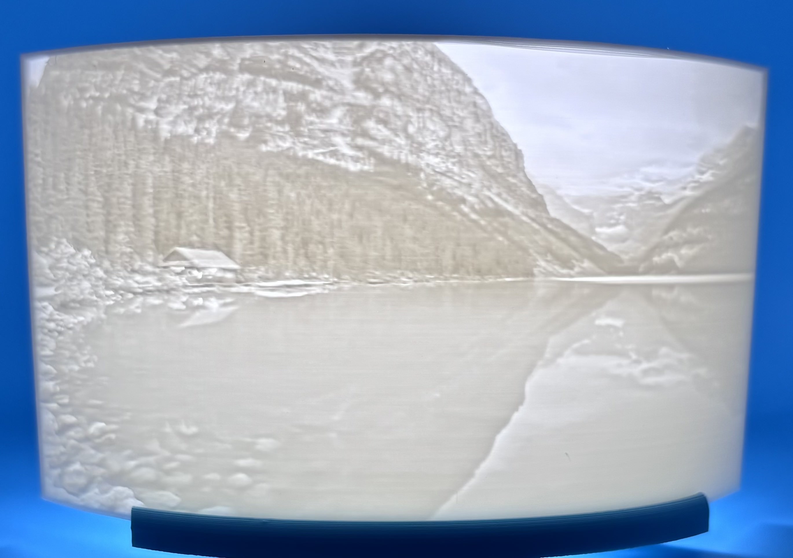 3D printed lithophane of a rocky mountain valley with layered depth and terrain detail