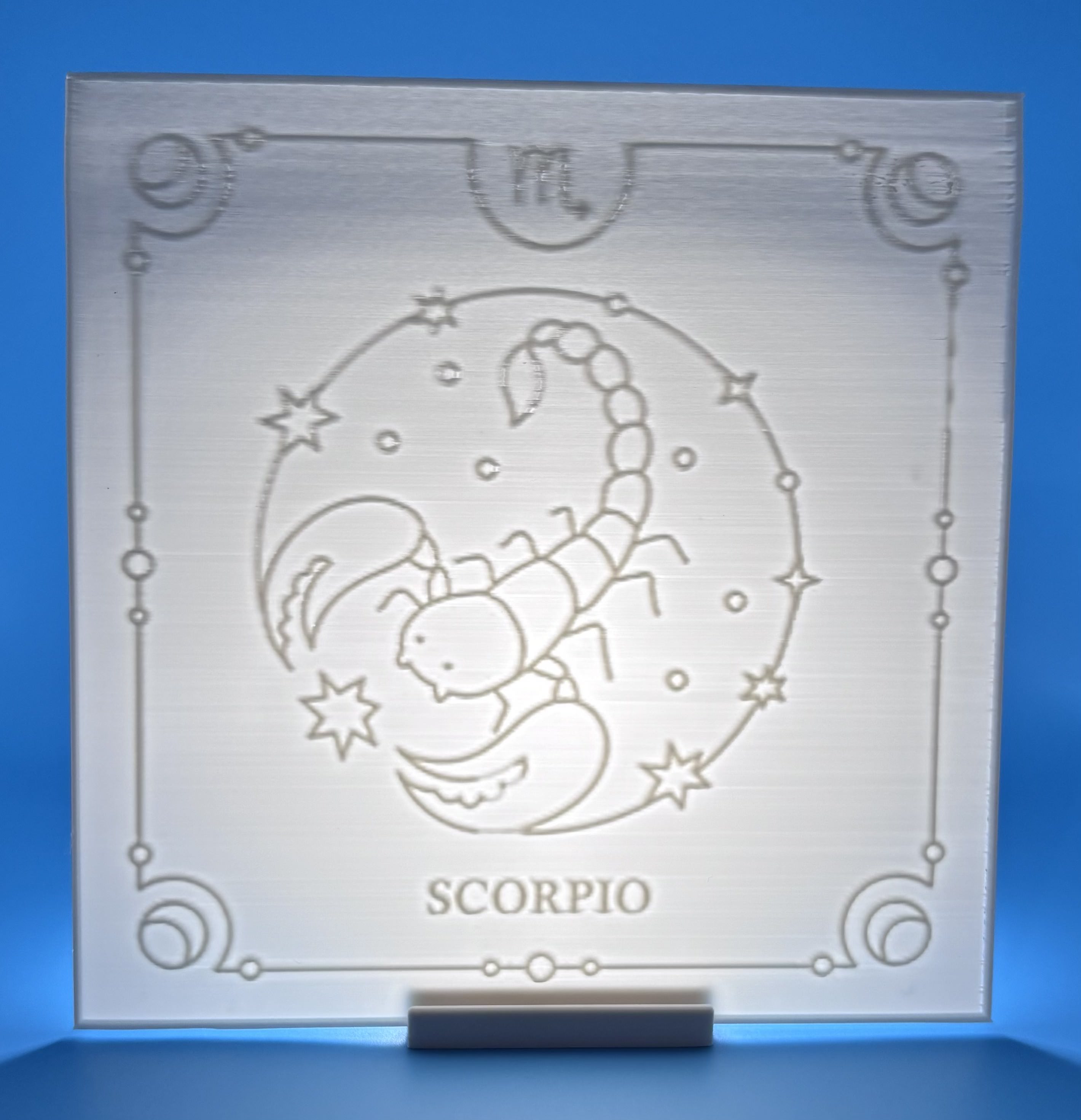 Vertical 3D printed Scorpio zodiac lithophane with scorpion illustration and star details