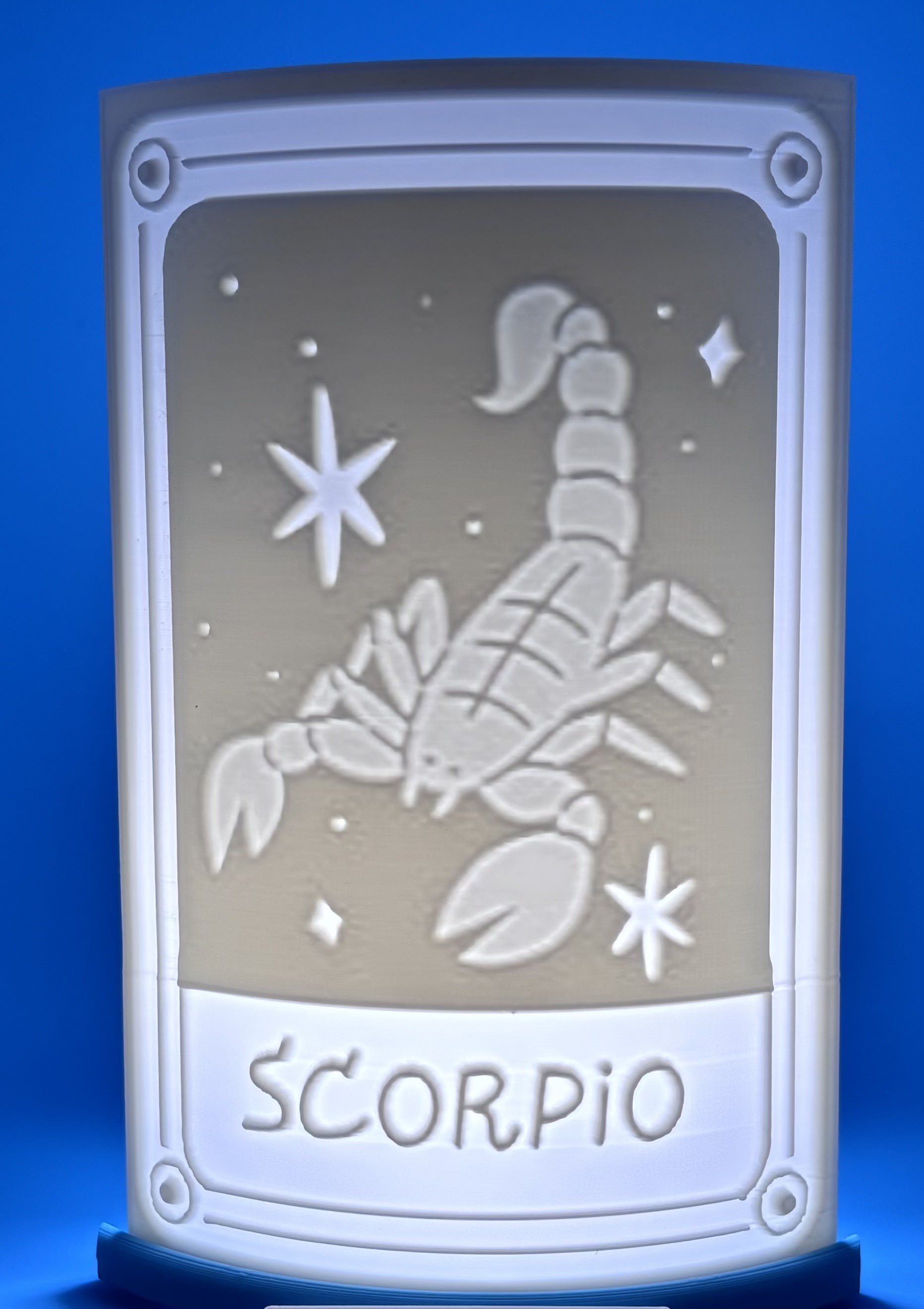 3D printed Scorpio zodiac lithophane featuring a scorpion constellation design illuminated on a light base