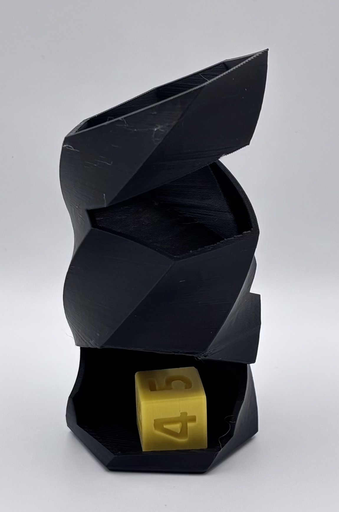 Side view of a 3D printed twisted dice tower showing the spiral drop path